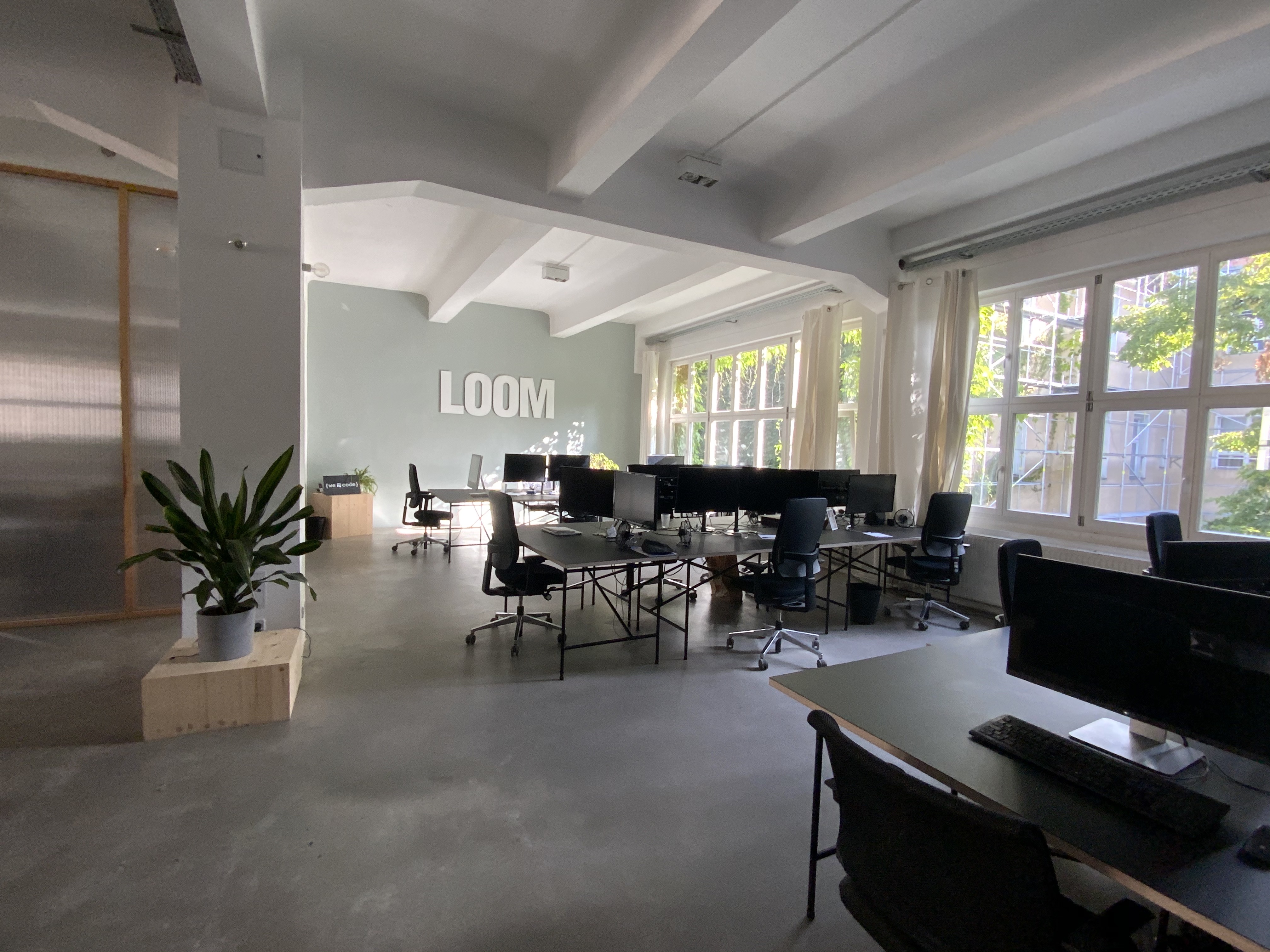 Computer workstations in an empty LOOM office in Berlin, an illustrative photograph from 2020.